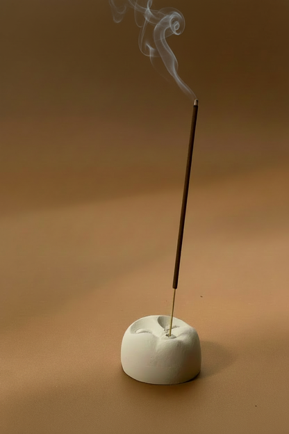 Incense holder with smoke from tip
